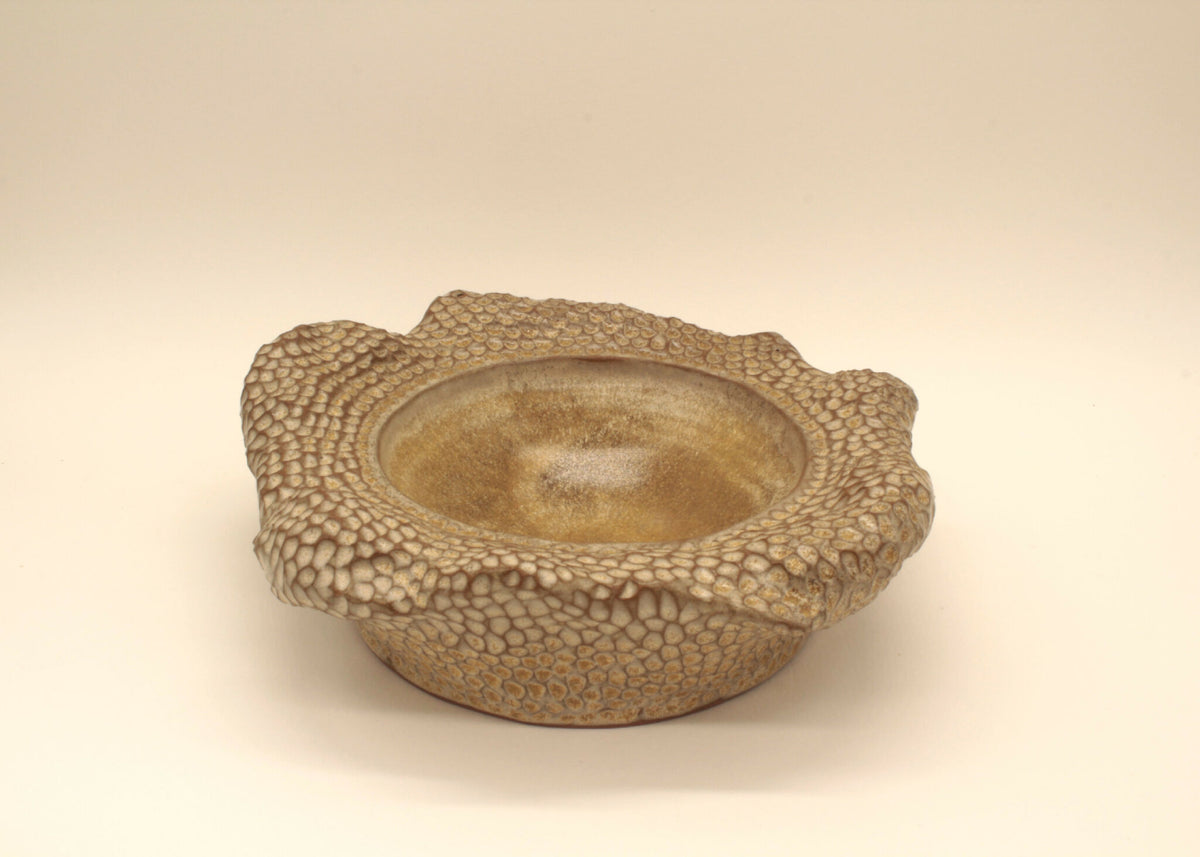 Coupelle double paroi beige à motif piqueté, base légèrement bombée