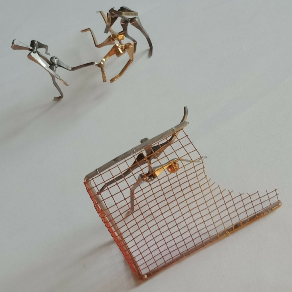 Figurines de joueurs de handball et but métallique avec grille rouge