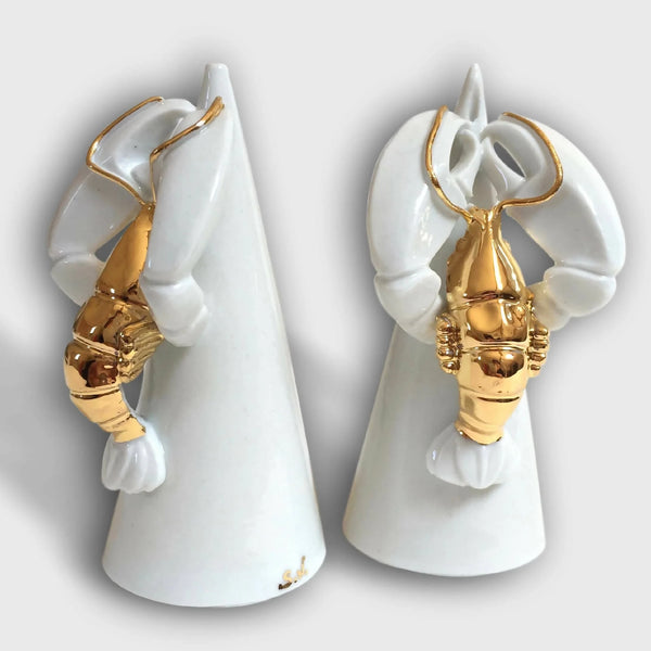 Salière et poivrière homard en céramique blanche avec détails dorés