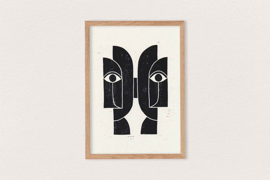 Linogravure encadrée « Sœurs Jumelles » : visages abstraits noir sur fond clair