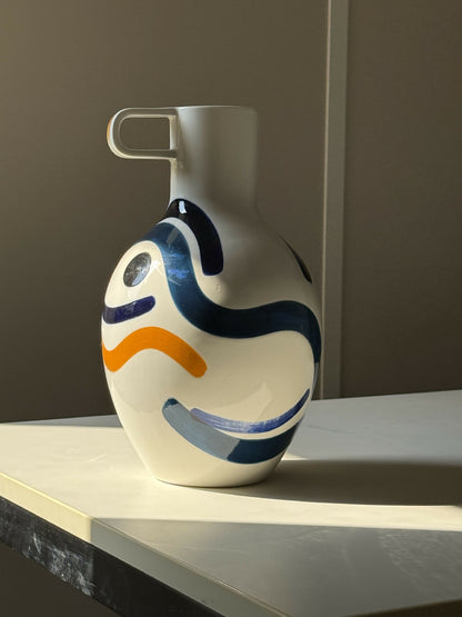 Large vase with bust and handle