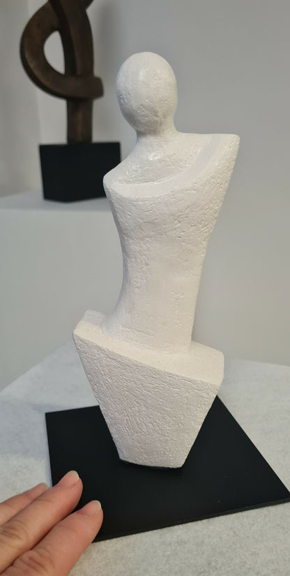 Contemporary clay sculpture of a woman on a metal base, "Carelessness"