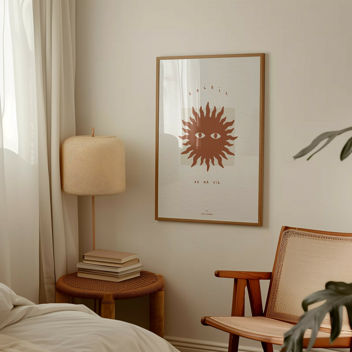 Affiche encadrée : soleil stylisé terracotta, yeux au centre.