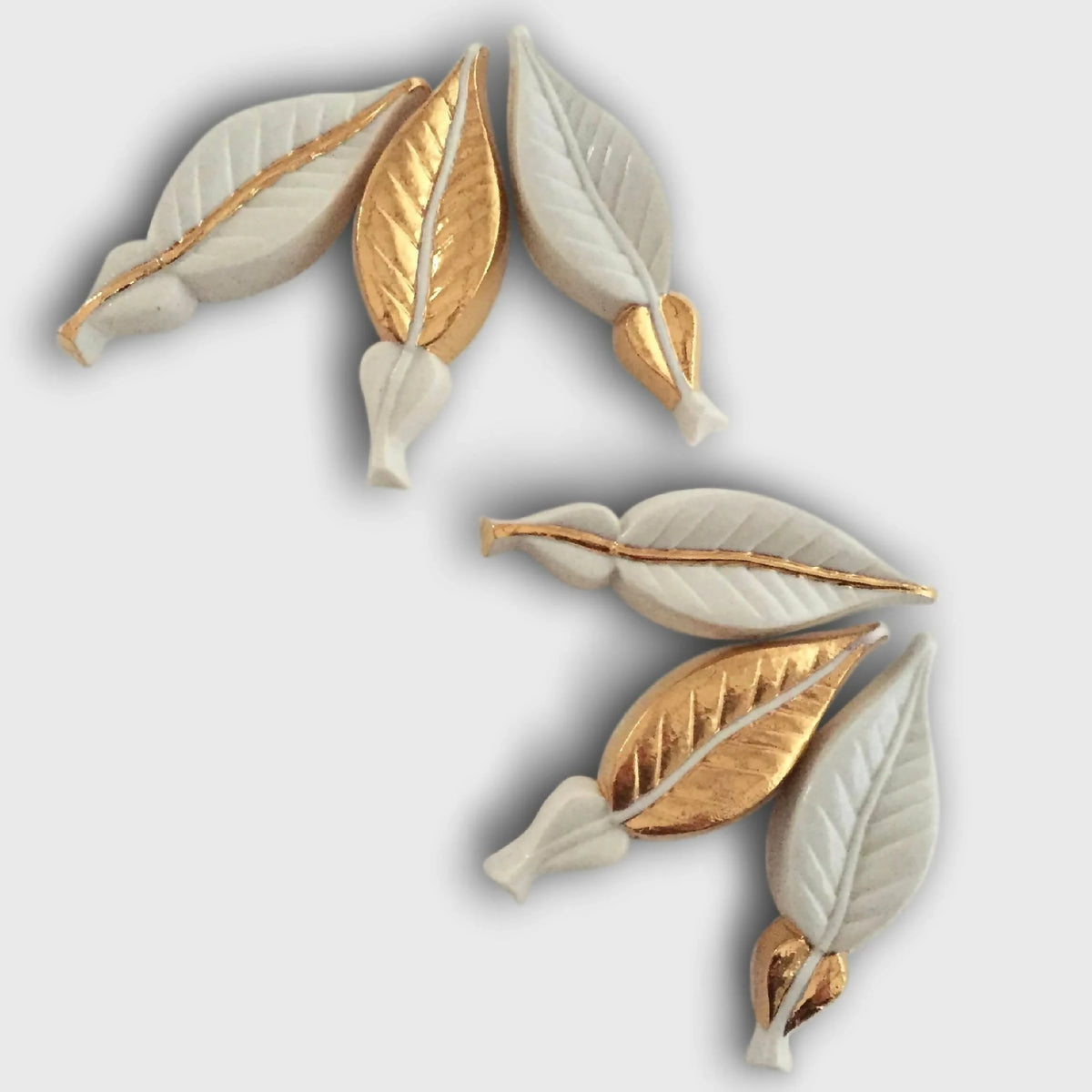 Jeu de 6 porte-couverts feuilles d’oranger dorées et blanches, nervures en relief