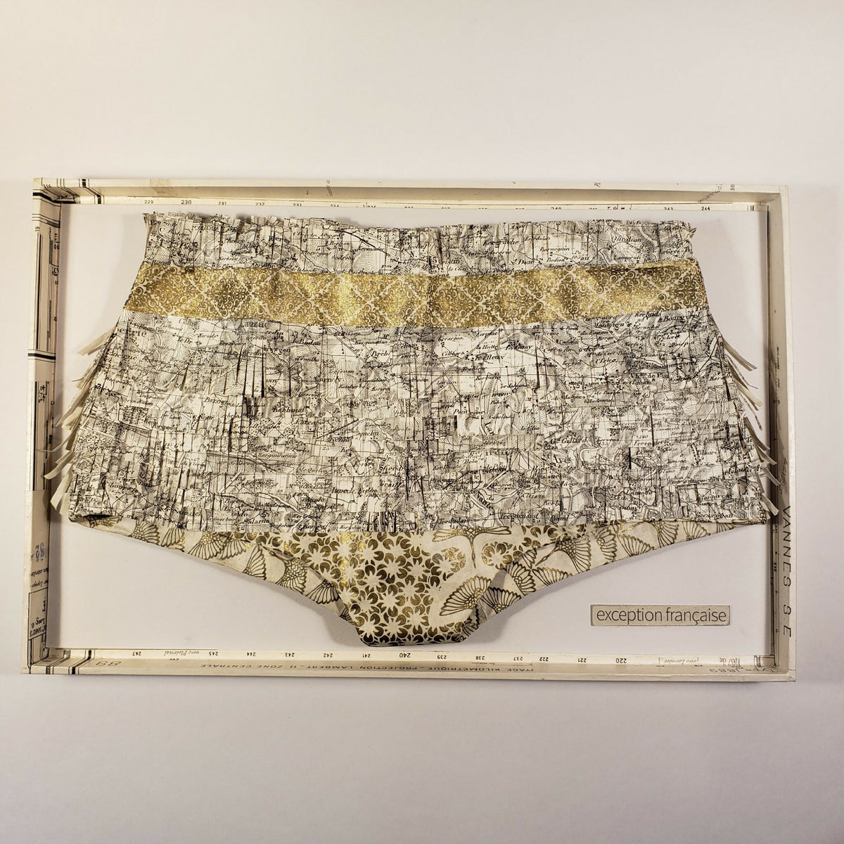 Culotte imprimée gris et doré, taille haute, bords festonnés