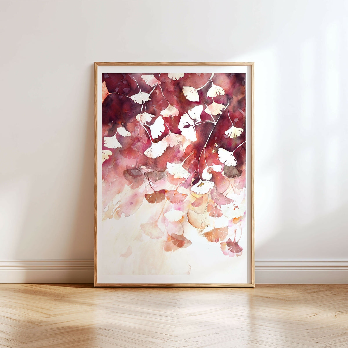 Aquarelle originale de ginkgo d’automne en couleurs rouge et blanc, encadrée.