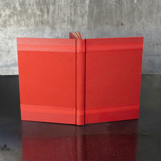 Carnet ou livre d'or rouge à couverture rigide, dos central
