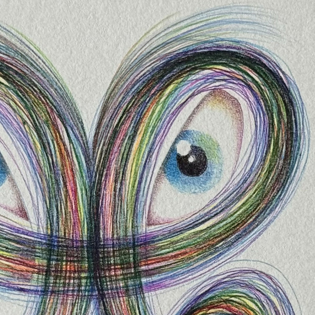 Motif de dragon en fil multicolore, gros œil bleu et boucles colorées