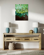 Tableau mural abstrait vert : facettes lumineuses, zone brun foncé, cadre noir.