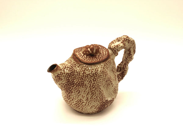 Théière beige à motif léopard, anse et bec, couvercle rond à bouton