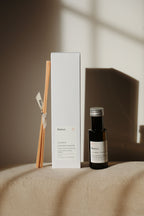 Diffuseur à bâtonnets Jasmin Frangipanier : flacon noir, bâtonnets et coffret