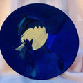 Encre « corps de lumière » : rond bleu avec silhouette dorée
