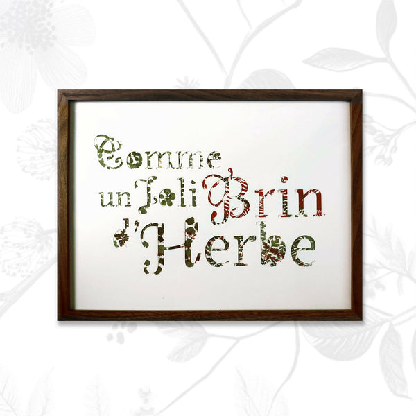 Tableau A3 encadré, texte en lettres formées par plantes séchées vertes et brunes