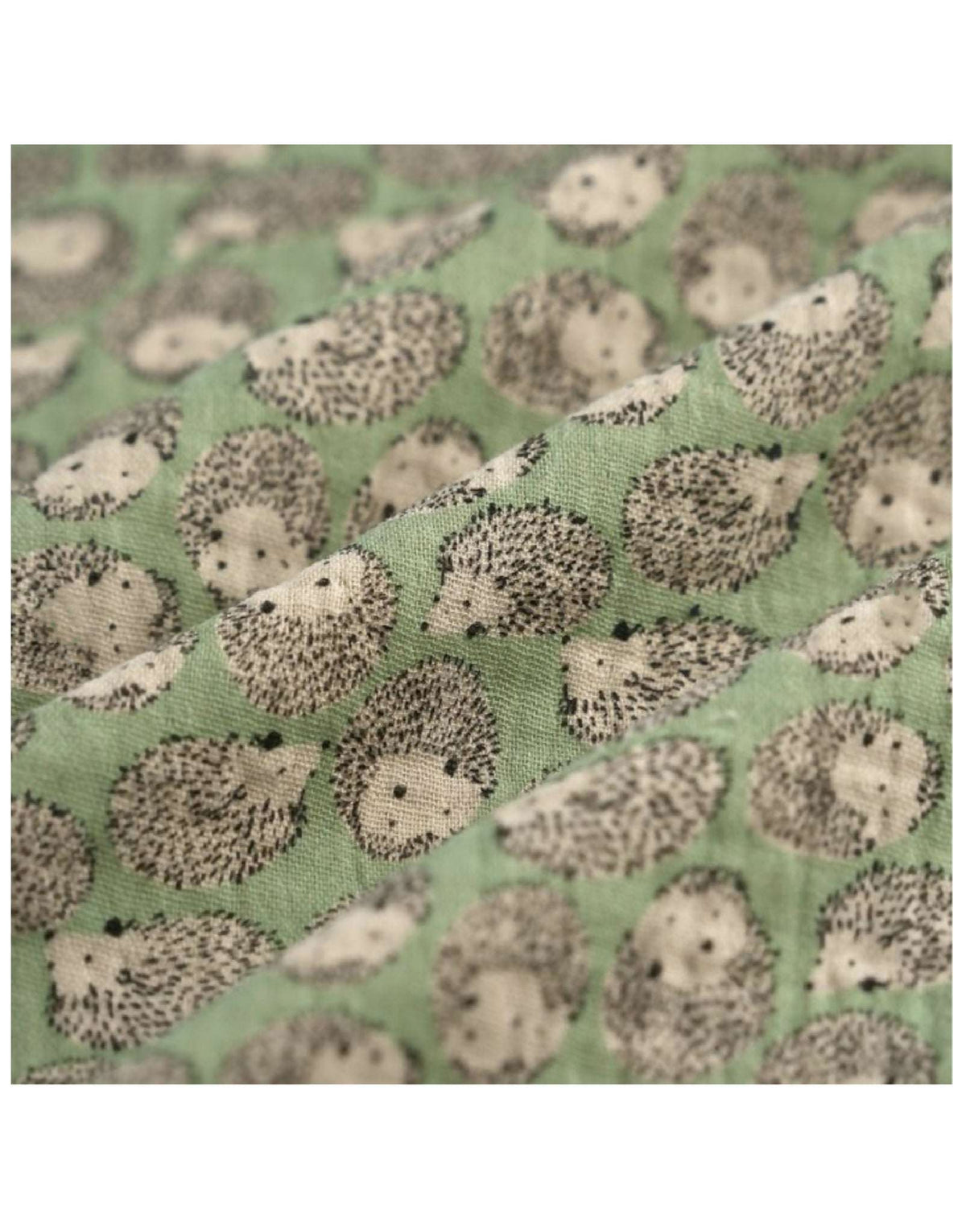 Tissu vert à motif de petits hérissons gris