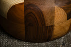 Détail de la table d’appoint en bois, courbe du piètement et raccords