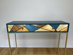 Console étroite, plateau bleu foncé et tiroir à motif géométrique bois, boutons ronds.