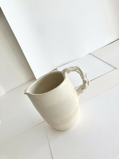 STONEWARE PITCHER "THE UGLY COWS"