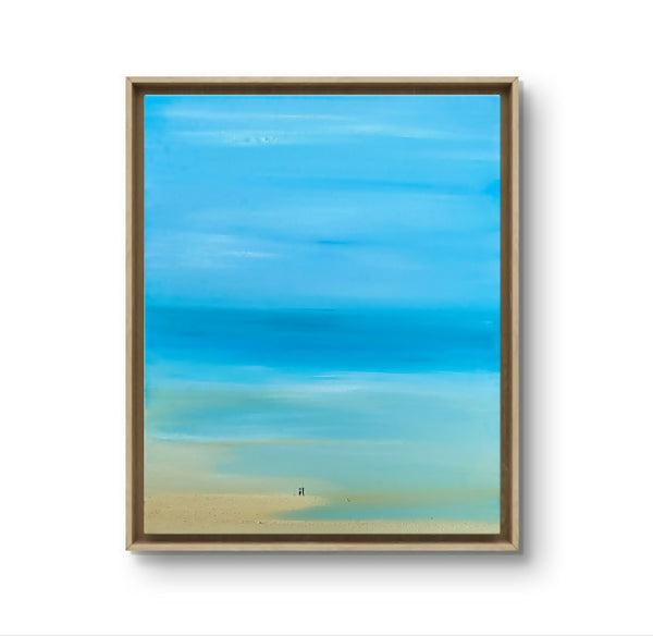 Tableau paysage bleu lagon, cadre en bois clair, teintes bleu et sable.