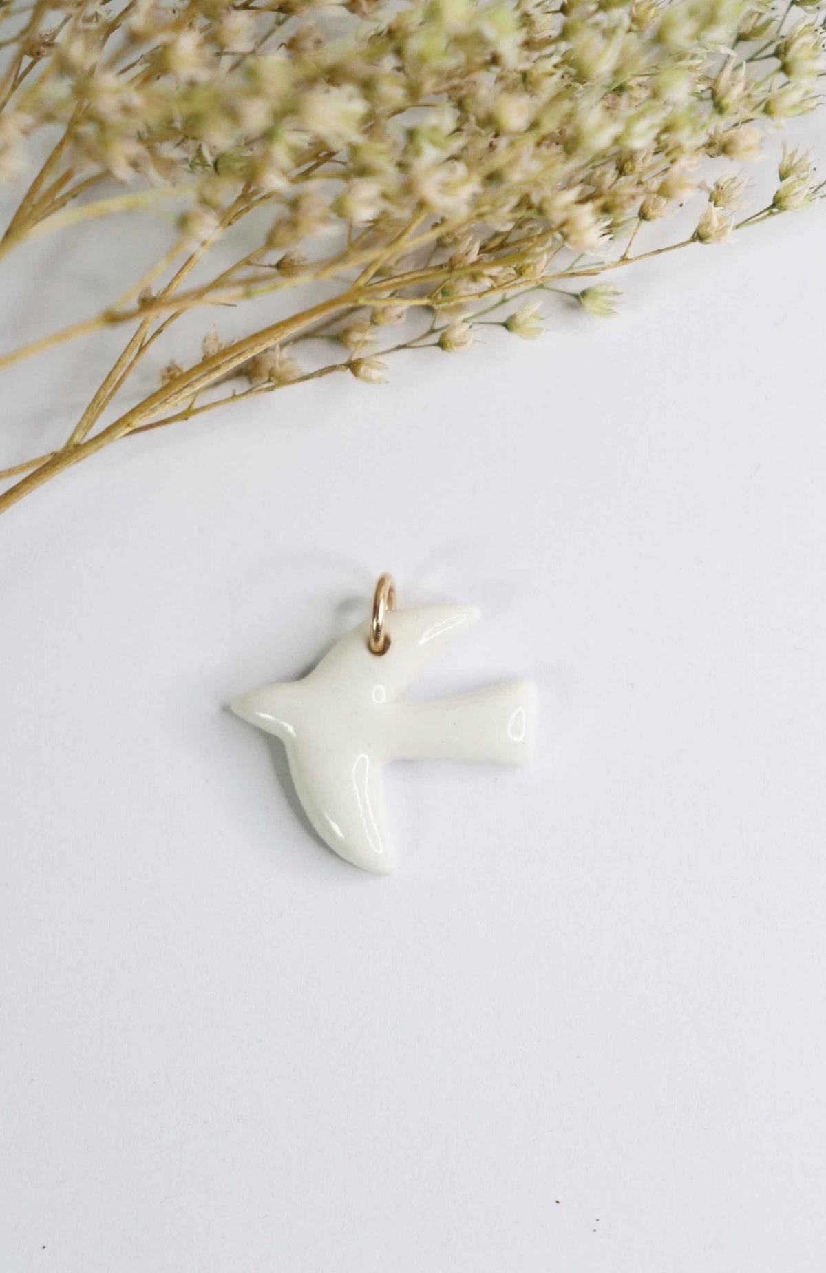 Pendentif breloque oiseau en porcelaine