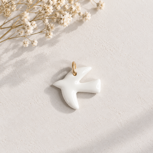 Pendentif breloque oiseau en porcelaine