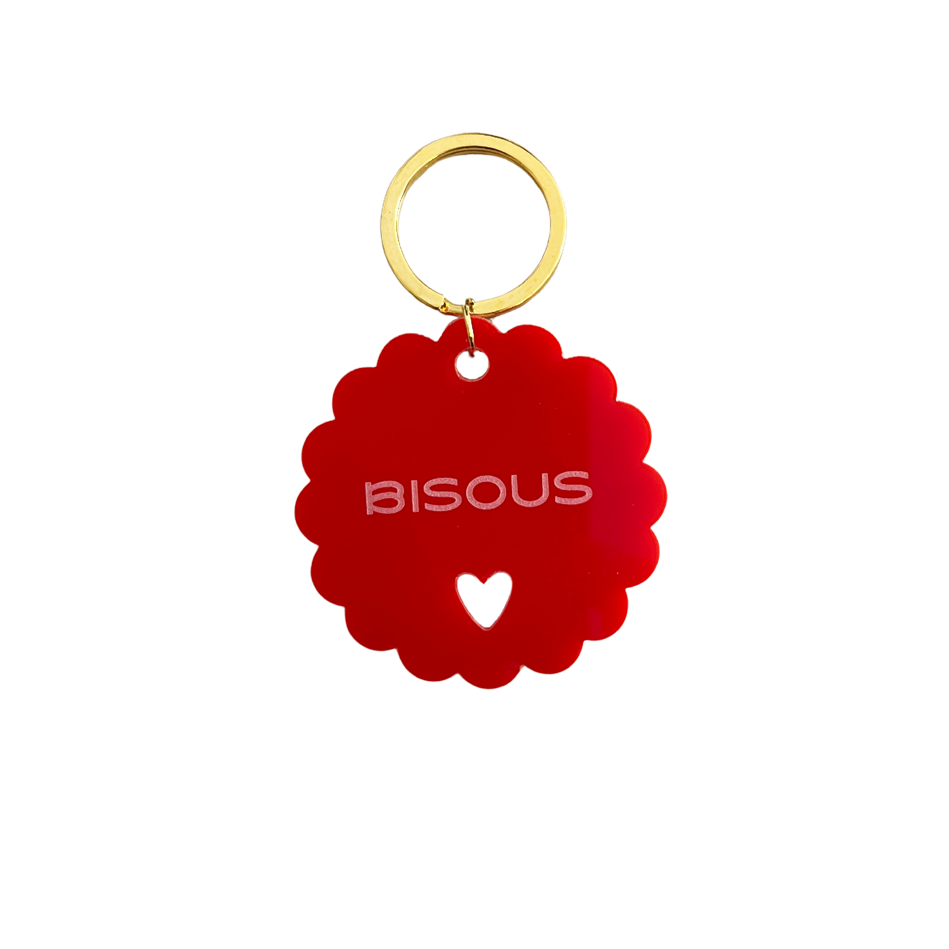 Gros plan du Porte-clé rouge à message positif : Bisous. Issu de l'artisanat français