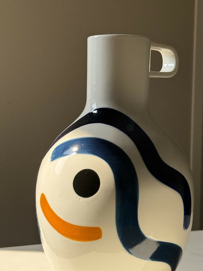 Large vase with bust and handle