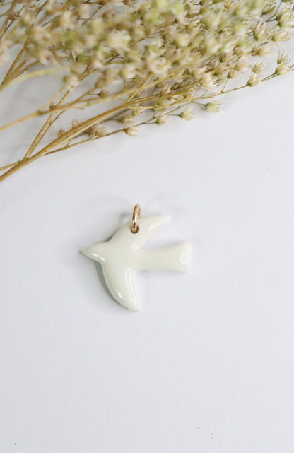 Pendentif breloque oiseau en porcelaine