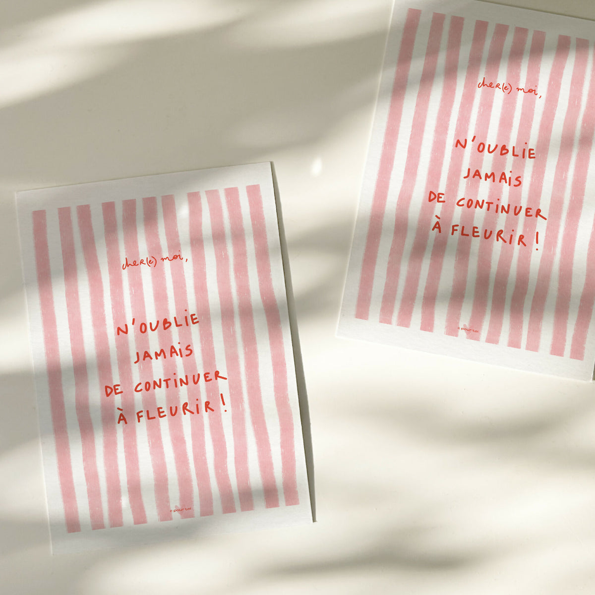 Carte de vœux rayée rose, texte « N’oublie jamais de continuer à fleurir ! »