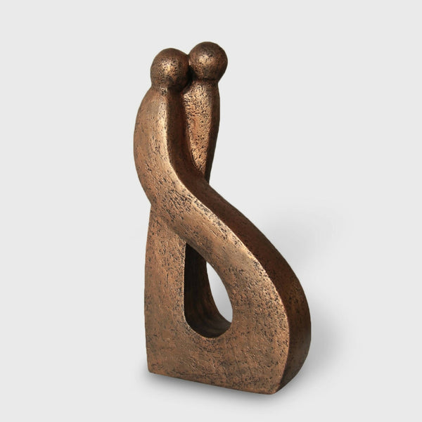 Sculpture abstraite en bronze, deux figures enlacées, forme courbée avec ouverture