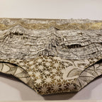 Culotte imprimée: dessus gris noir, fond beige à fleurs dorées