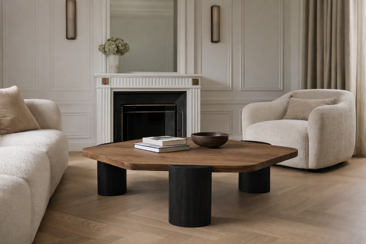 Table en noyer au plateau rectangulaire arrondi et quatre pieds cylindriques.