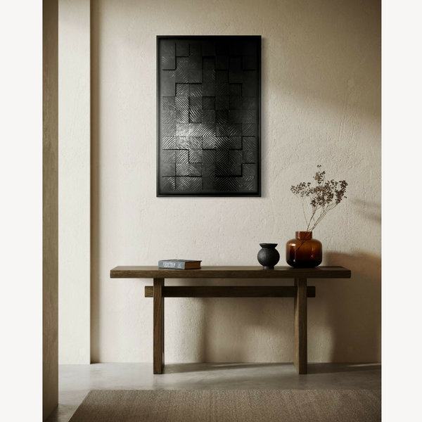 Tableau encadré noir et gris, composition géométrique avec texture en damier.