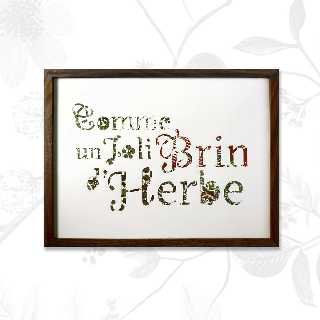 Tableau A3 encadré, texte en lettres formées par plantes séchées vertes et brunes