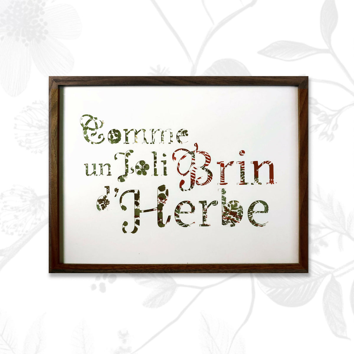 Tableau A3 encadré, texte en lettres formées par plantes séchées vertes et brunes