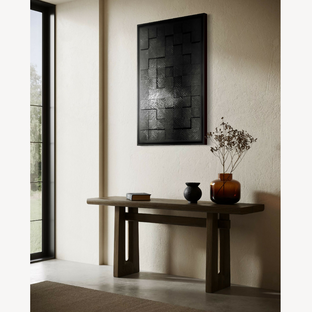 Tableau abstrait noir à formes rectangulaires en relief, bordure noire mate.