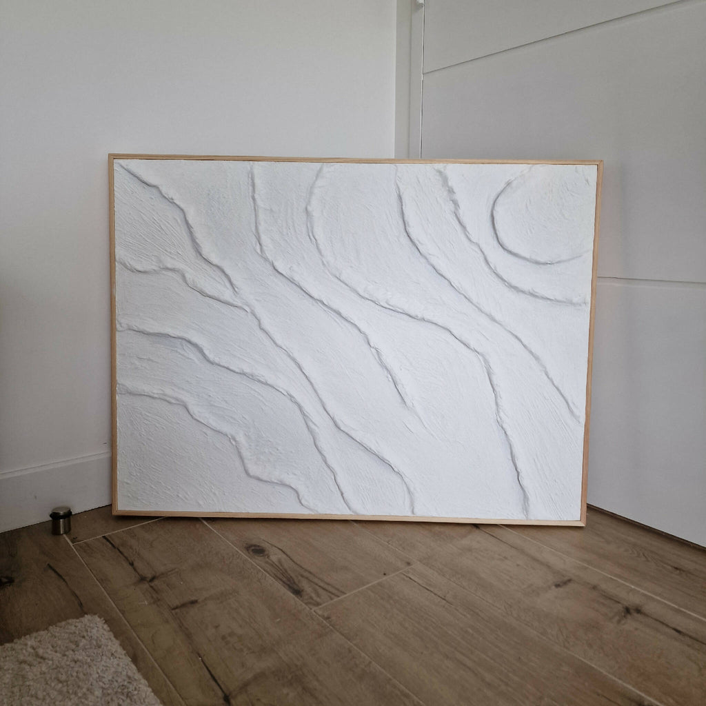 Tableau texturé blanc rectangulaire, relief en creux ondulés, cadre bois