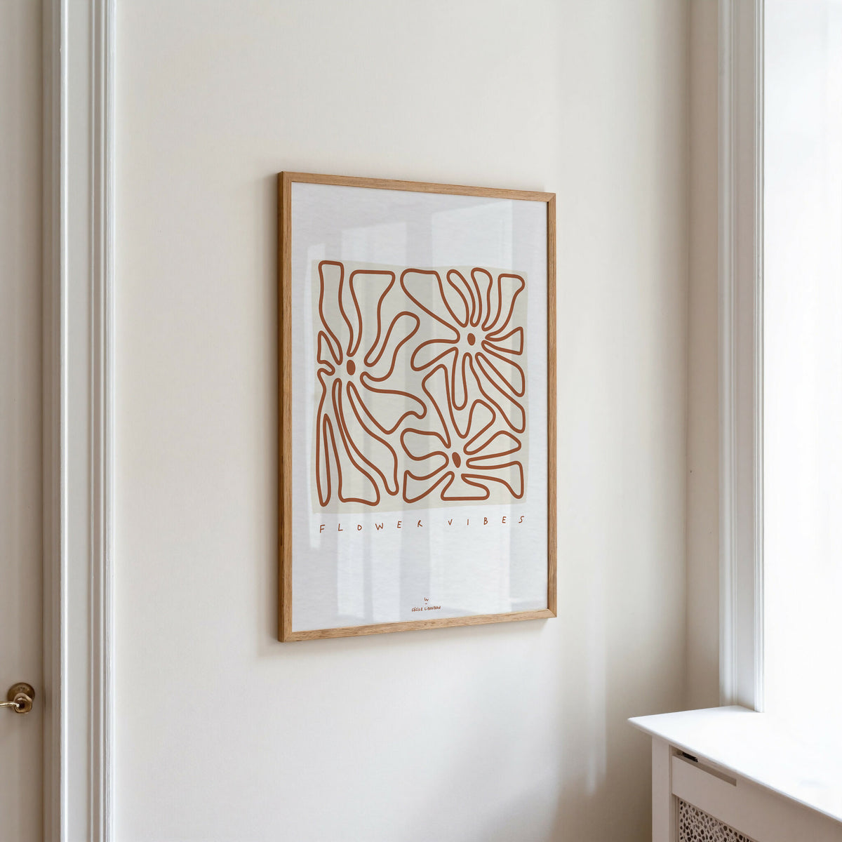 Affiche A4 encadrée : fleurs au trait terracotta, cadre en bois clair, « FLOWER VIBES »
