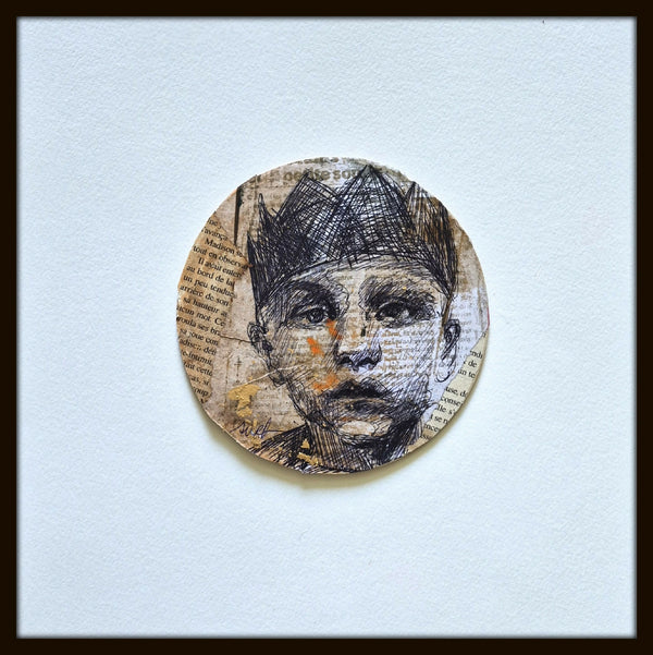 Tableau original encadré : portrait circulaire en encre noire et beige, touches orange.