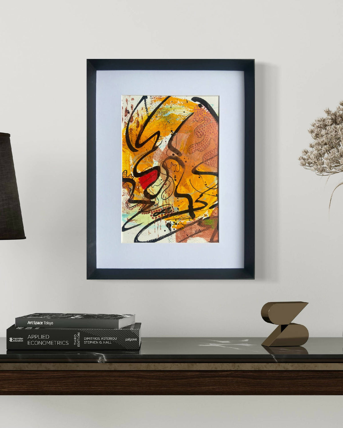 Tableau abstrait encadré, orange et jaune, traits noirs, format carré.