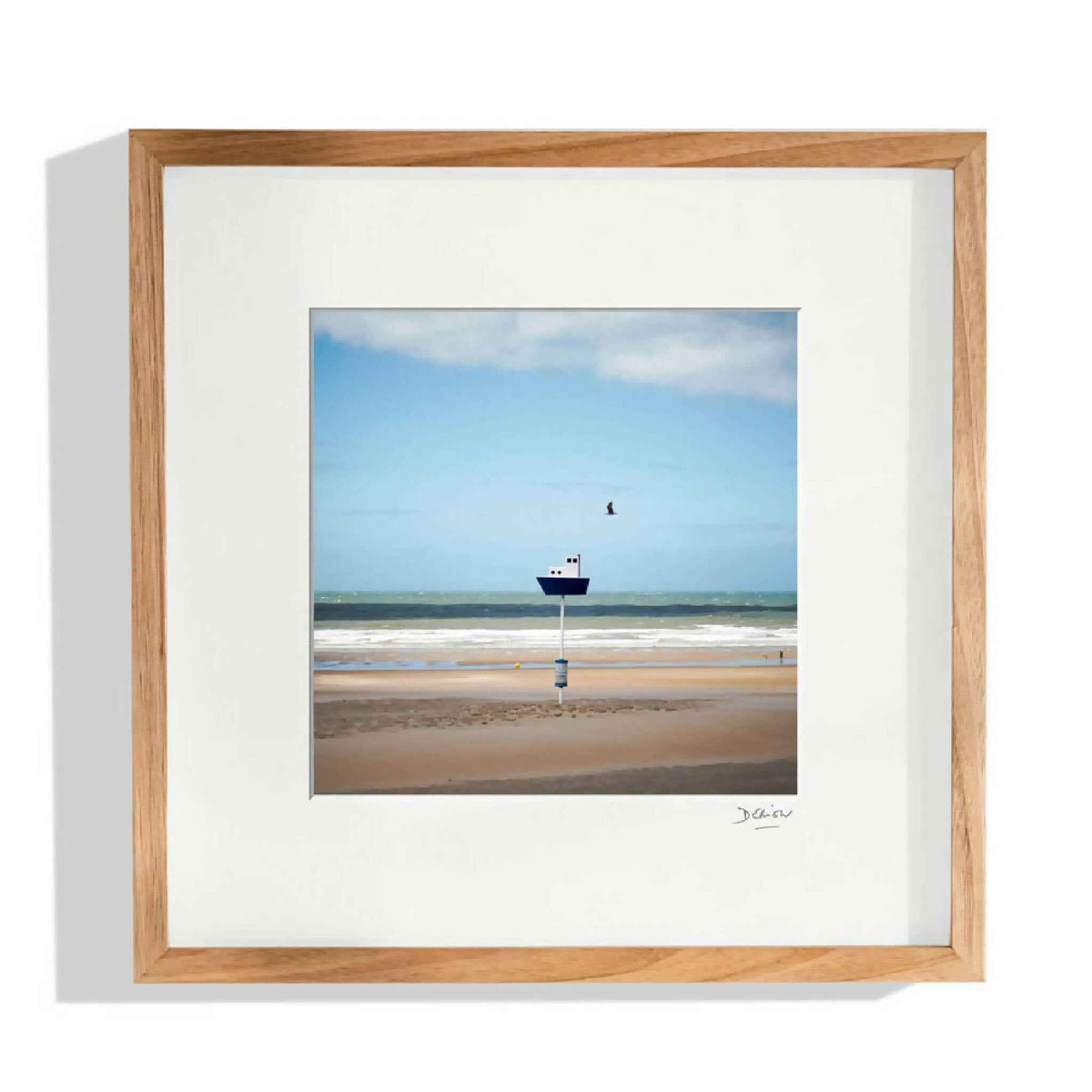 Image encadrée paysage de plage avec bateau au large