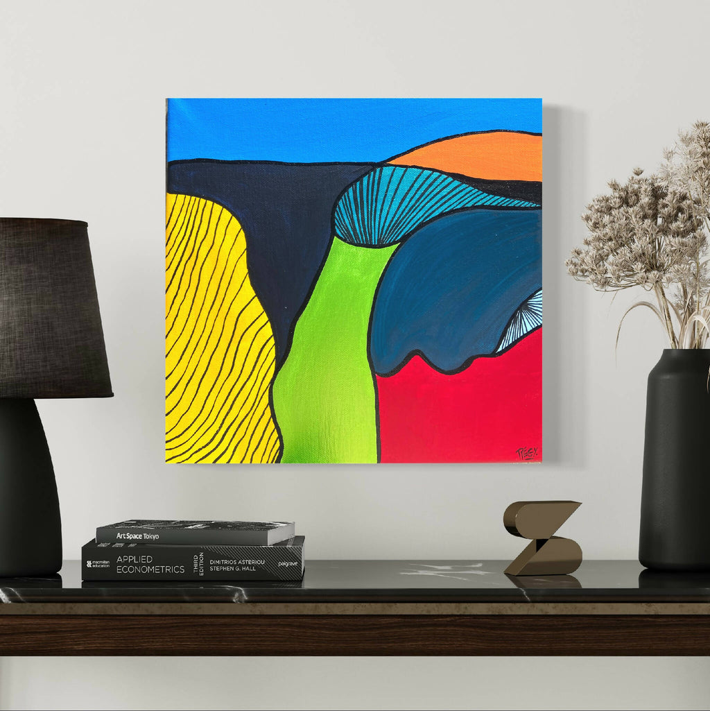 Peinture abstraite sur toile, cadre bleu, formes courbes et couleurs vives.