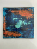 Tableau abstrait encadré, fonds bleu et orange, touches peintes texturées.